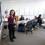 Assistant Professor Ellen Middaugh interacts with students in her Sweeney Hall classroom on September 26, 2018. (Photo: Jim Gensheimer)